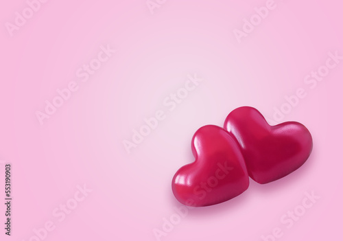 Two pink Valentine's day heart on empty pastel pink paper background. Love concept, top view. Minimalism style.