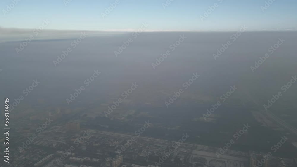 Aerial view of polluted city covered with smog Aerial view of polluted city covered with smog