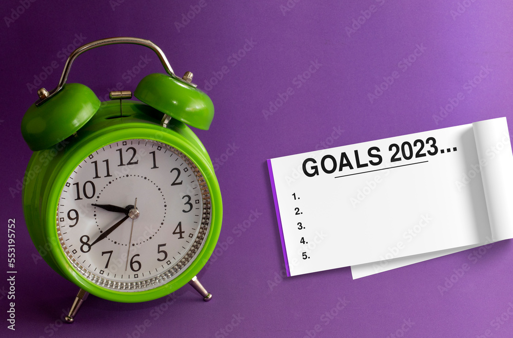GOALS 2023. Work planning for New 2023 Year in office purple background