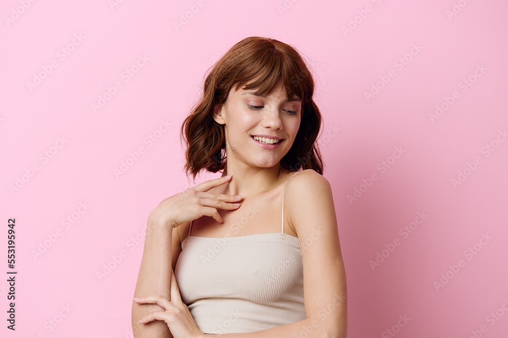 horizontal photo on a pink background of a beautiful, elegant woman standing in a relaxed pose with her eyes closed, smiling gently horizontal photo on a pink background of a beautiful, elegant woman standing in a relaxed pose with her eyes closed, smiling gently