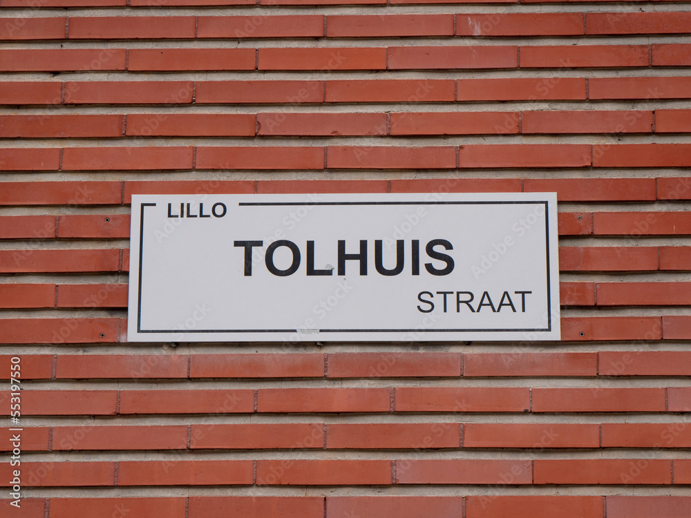 Street name with inscription, Lillo, tolhuisstraat which means toll house in the porlder village of Lillo in Belgium