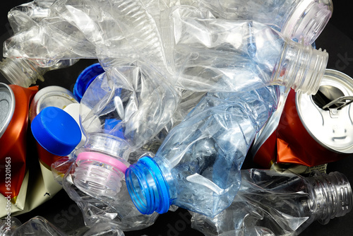 Crumpled plastic bottles and aluminum cans, background