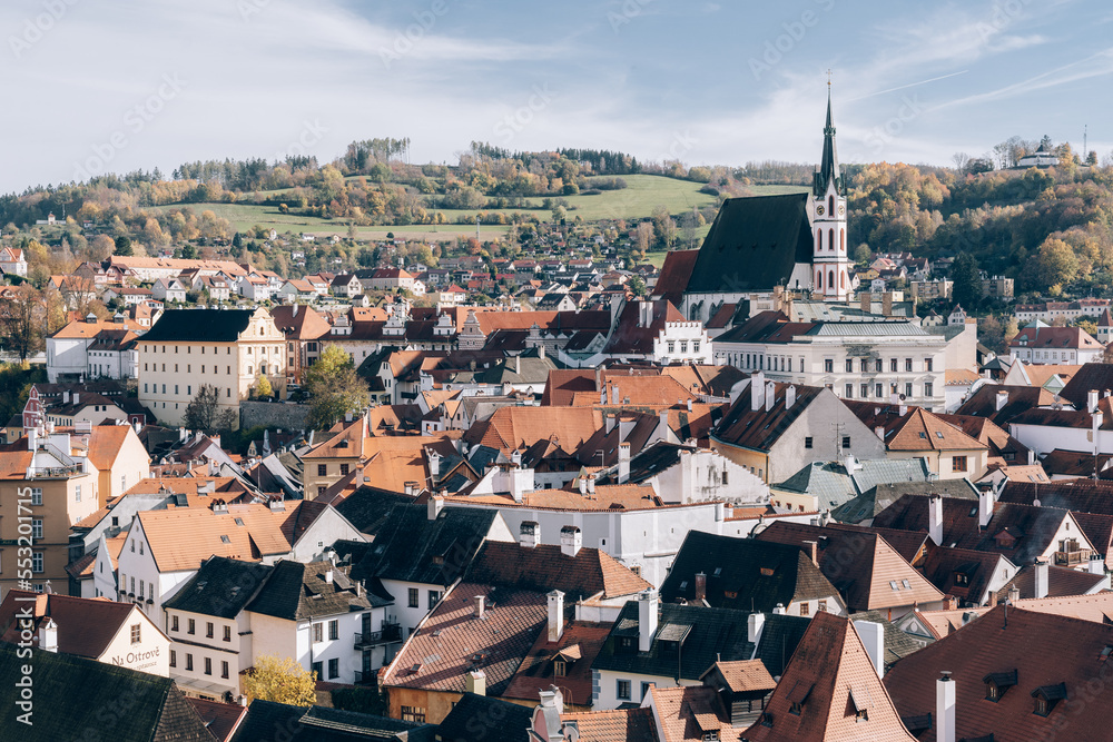 Cesky Krumlov, Czech - Nov 21, 2022 : The scenery of buildings in the southern part of the Czech Republic, the harmony of orange roofs and green hills in the distance is like a fairy tail