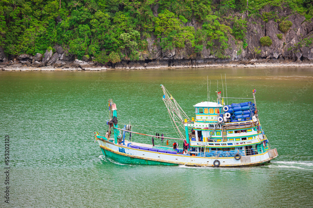 Fishing boats floating on the sea. Fishermans in the boat in the mountain. Fishing boats floating on the sea. Fishermans in the boat in the mountain.