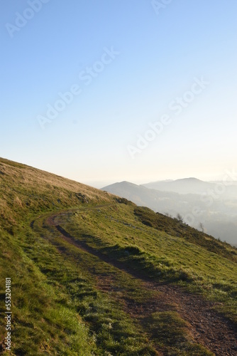 the top of the Malvern hills on a misty day during sunset