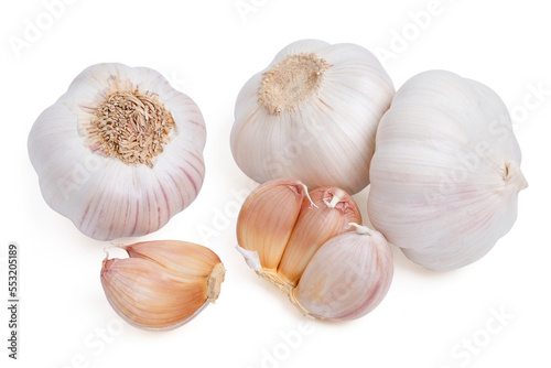 Top view fresh peeled garlic cloves, bulb with slices on white background.