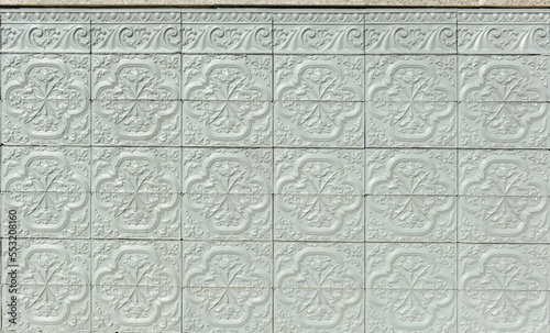 Fotografie Gray painted ceramic tiles on a spanish house facade