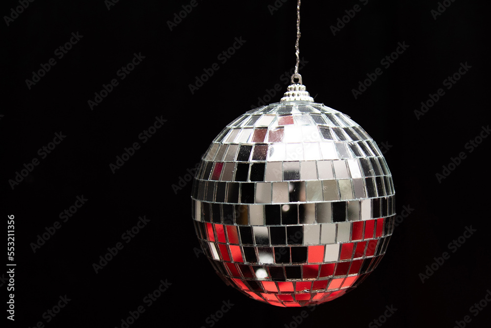 Obraz premium silver mirror balls on red gifts and black background