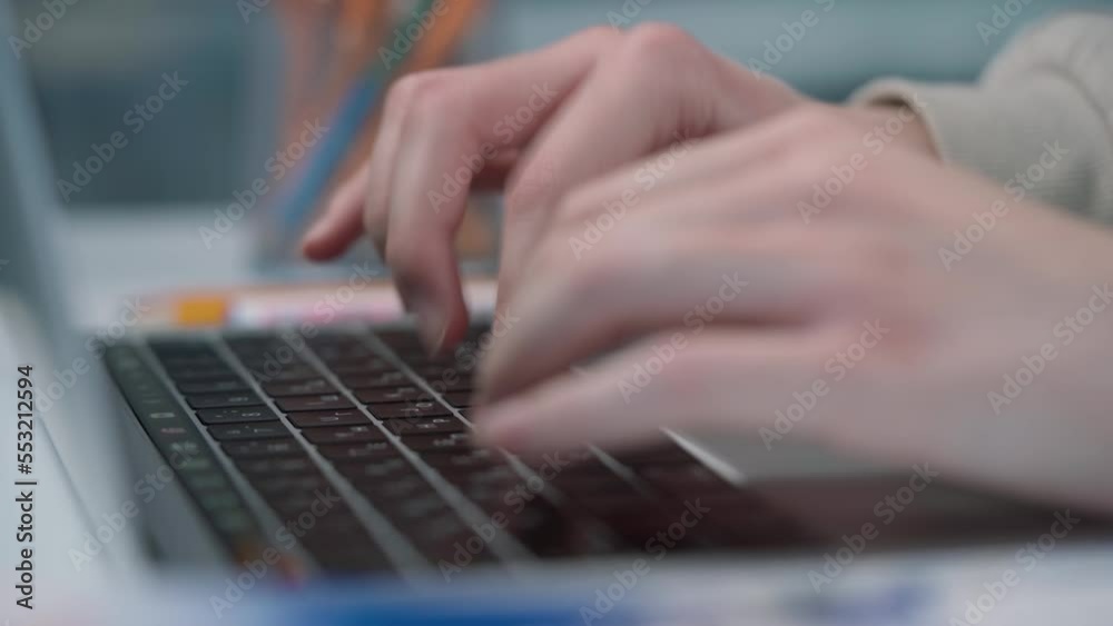 Close-up of Women's Hands Typing on Notebook Keyboard Close-up of Women's Hands Typing on Notebook Keyboard