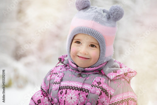 Happy Toddler girl winter portrait. Playing outside on Christmas holiday