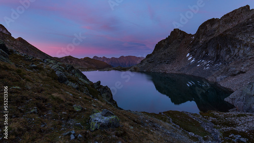 Alpine lake reflections after sunset, blue hour