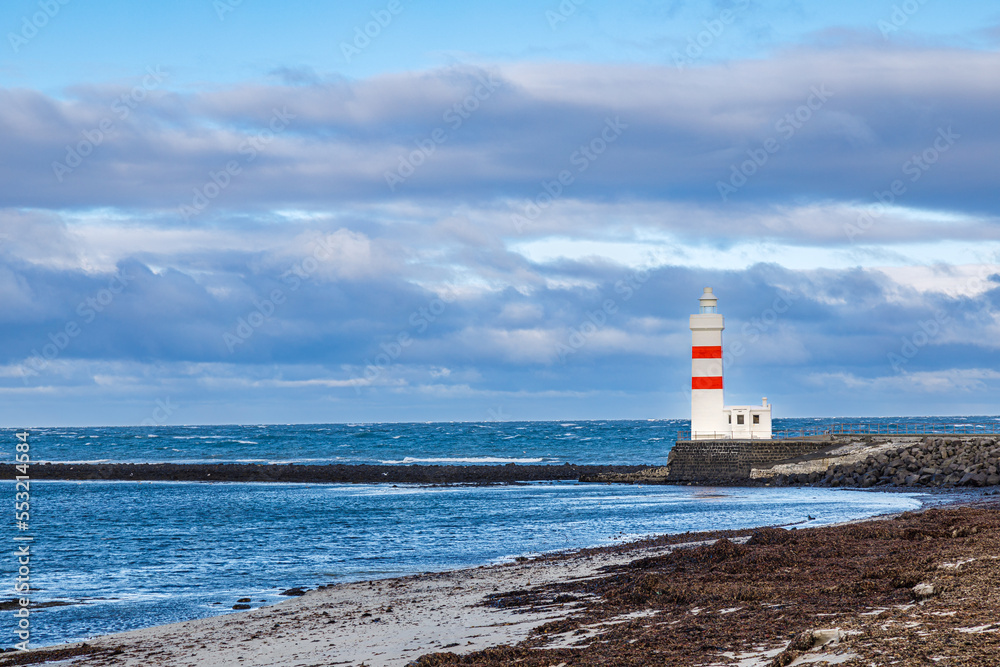 Lighthouse on the coast of Icelandic sea, Iceland