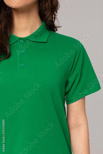 blank green polo shirt on woman isolated on white background. Close-up Mock-Up