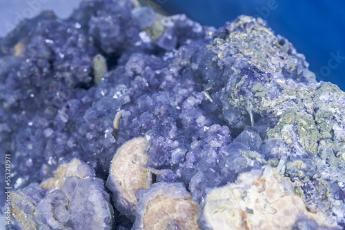 Closeup of naturally occurring rare purple crystalline ore