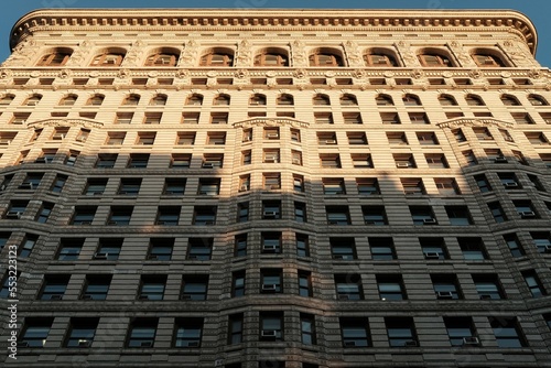 NEW YORK, USA - March 19, 2018 : Flat Iron building facade on March 19, 2018. Completed in 1902, it is considered to be one of the first skyscrapers ever built
