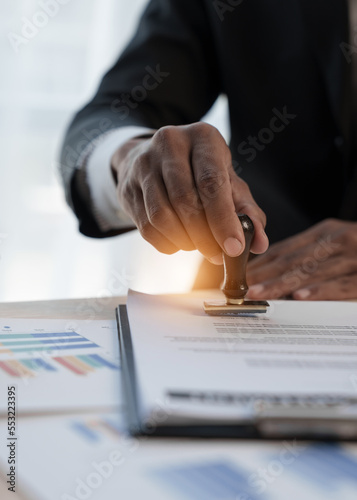Loan approver, businessman in suit, man using stamp for car loan approved