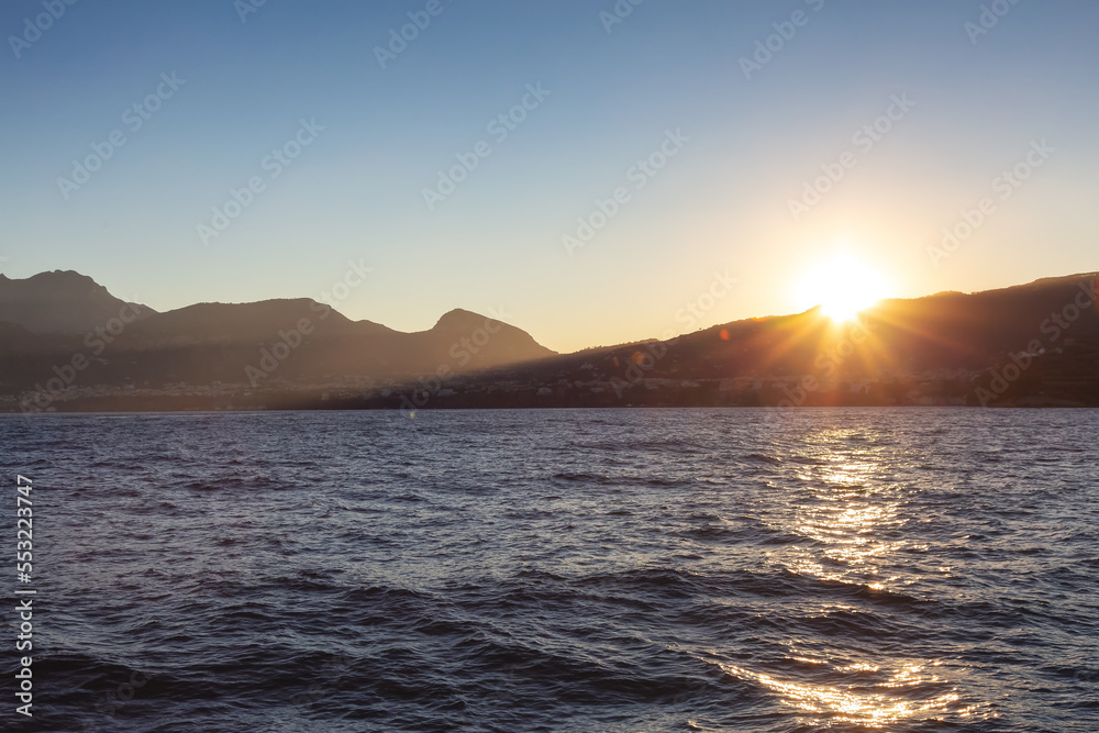 Capri Island in Bay of Naples, Italy. Sunny Sunrise Sky. Nature Background. Capri Island in Bay of Naples, Italy. Sunny Sunrise Sky. Nature Background.