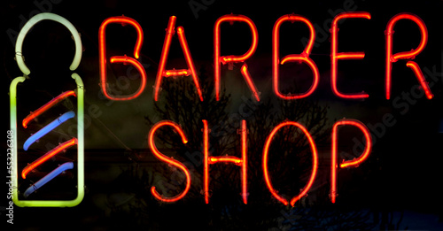Bright red, blue and green BARBER SHOP neon sign.