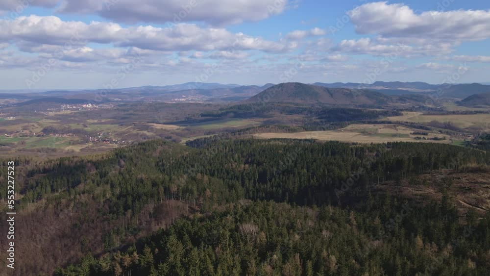 Aerial birds eye view of beautiful mountains covered with evergreen forest at sunny autumn day. Nature landscape with mountains ranges and valleys Aerial birds eye view of beautiful mountains covered with evergreen forest at sunny autumn day. Nature landscape with mountains ranges and valleys