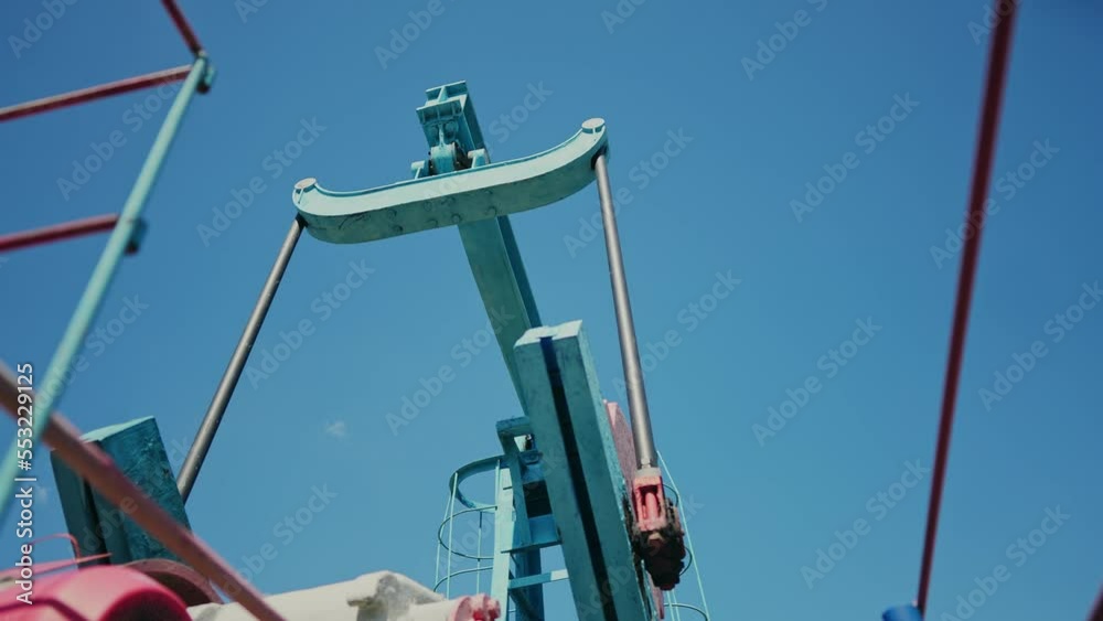 oil pump. oil rig mechanism pumping oil and gas. business industry lifestyle concept. rig energy petroleum barrel. oil pump pumps from the ground business finance concept oil pump. oil rig mechanism pumping oil and gas. business industry lifestyle concept. rig energy petroleum barrel. oil pump pumps from the ground business finance concept