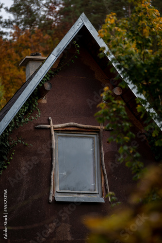cottage among the trees in autumn