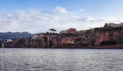 Homes and Hotels in a touristic town on the seafront. Sorrento, Compania, Italy. Colorful Cloudy Sky Art Render.