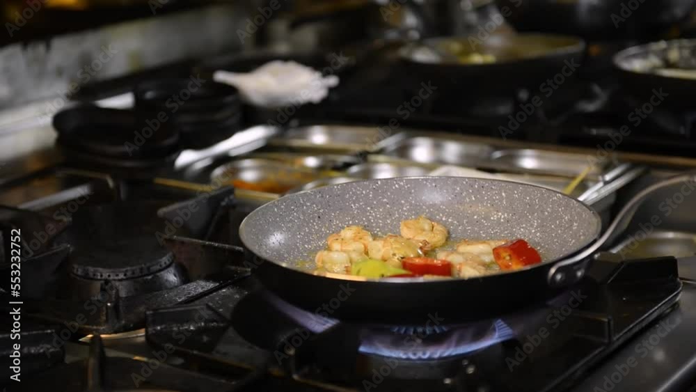 Shrimps frying in pan with vegetables Shrimps frying in pan with vegetables