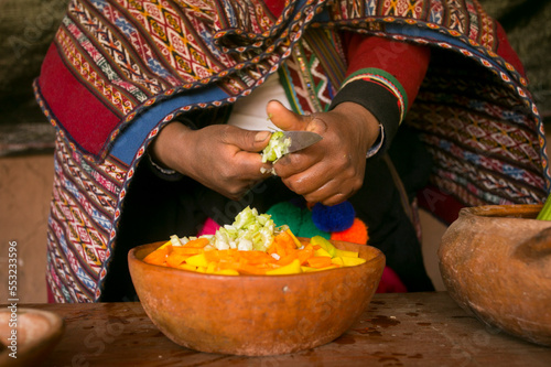 Fotografiet Cooking a traditional Andean vegetable soup before a Pachamanca feast with a Quechua tribe in the Sacred Valley, Peru