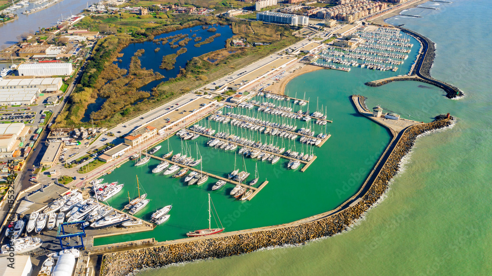 Aerial view on Ostia marina in Rome, Italy. Many boats are parked at the port.