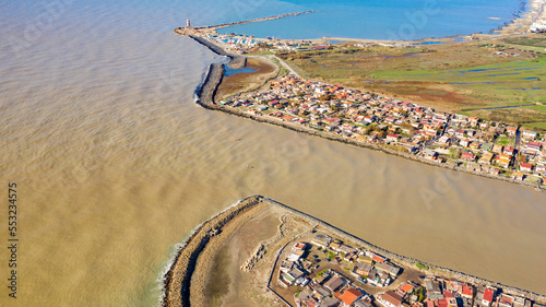 Aerial view of the Tiber River estuary in the Tyrrhenian Sea. It is located in the municipality of Fiumicino near Rome, Italy.