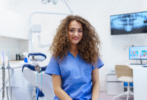 Portrait of young woman dentist at private dental clinic.