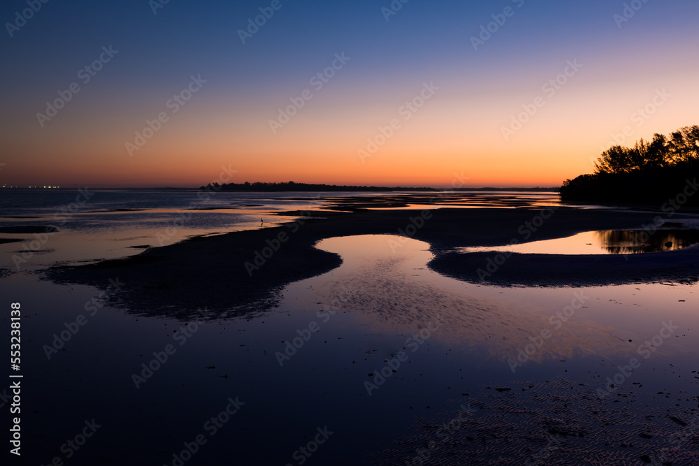 Fototapeta premium Sun rises over tidal pools in St. Petersburg