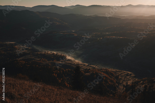 Beautiful mountains view in the morning. Autumn foggy landscape