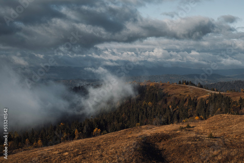 Mountain range. Autumn day landscape with long road.  © Yurii Kushniruk