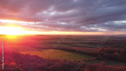 4K drone Aerial video establishing shot of countryside in Oxfordshire at sunset