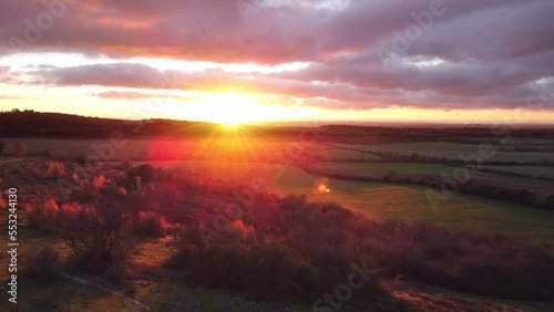 4K drone Aerial video establishing shot of countryside in Oxfordshire at sunset