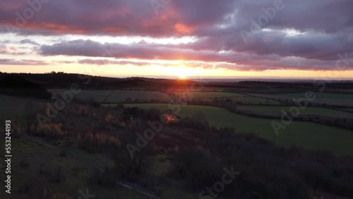 4K drone Aerial video establishing shot of countryside in Oxfordshire at sunset