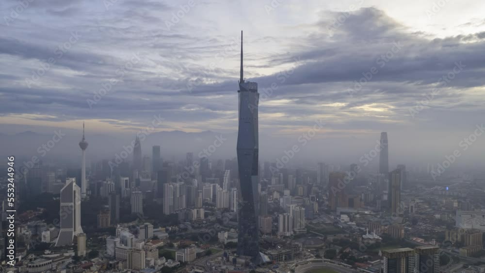Aerial view hyperlapse 4k video of Kuala Lumpur city center view during dawn overlooking the city skyline in Federal Territory, Malaysia. Tilt down Aerial view hyperlapse 4k video of Kuala Lumpur city center view during dawn overlooking the city skyline in Federal Territory, Malaysia. Tilt down