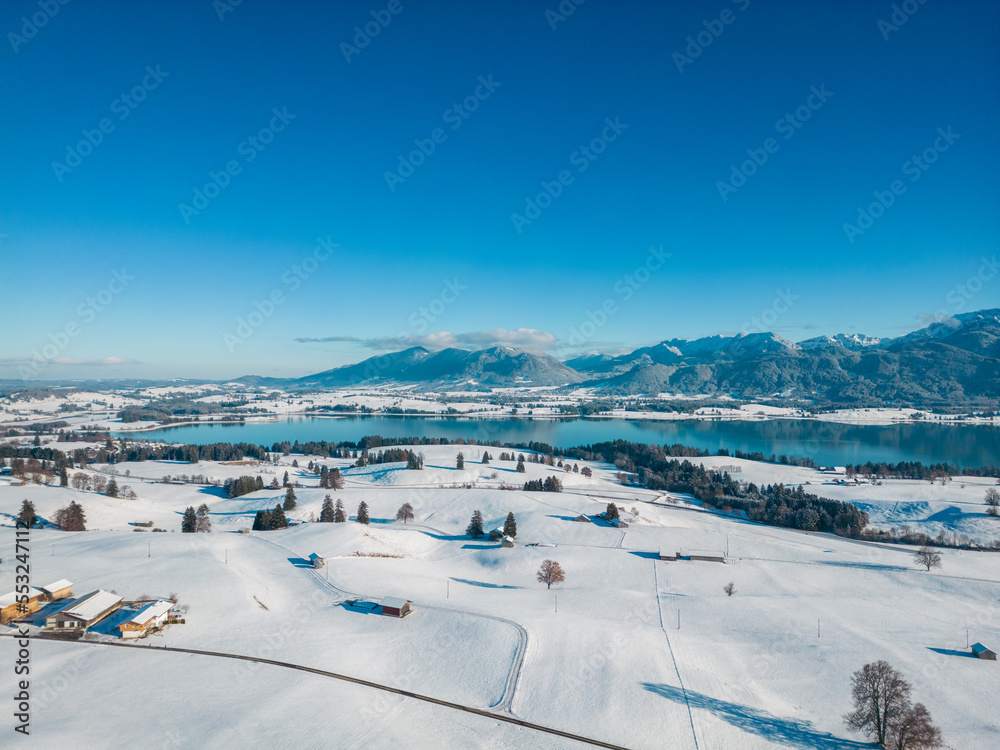 Winter landscape in the Allgäu with mountains and a lake