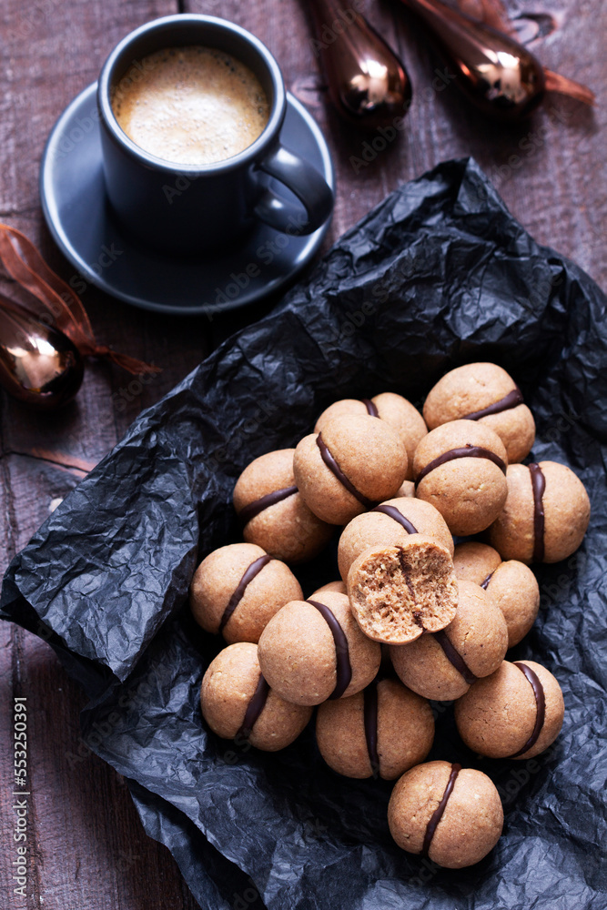 Lady's kisses, traditional Italian nut cookies with coffee and chocolate filling.