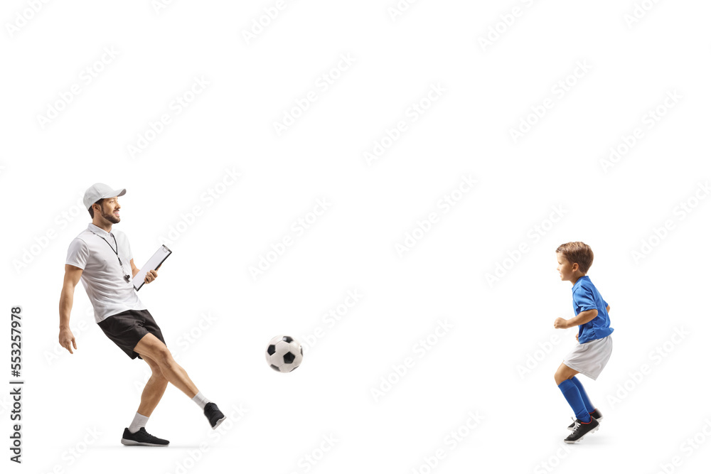 Football coach with a whistle holding a clipboard and training with a boy