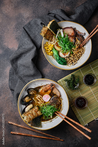 Shoyu Ramen and Udon noodles on dark background