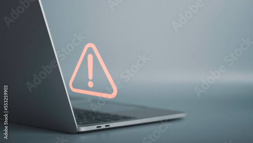 Triangle caution warning sign on laptop screen and Businessman or it staff , programmer, developer using computer for notification problem error 404 and maintenance concept.