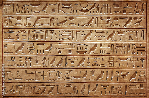 Old Egyptian hieroglyphs on an ancient background. Wide historical and culture background. Ancient Egyptian hieroglyphs as a symbol of the history of the Earth.