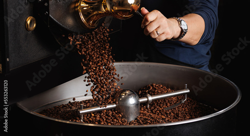 Brown coffee beans roasting process on professional roaster machines