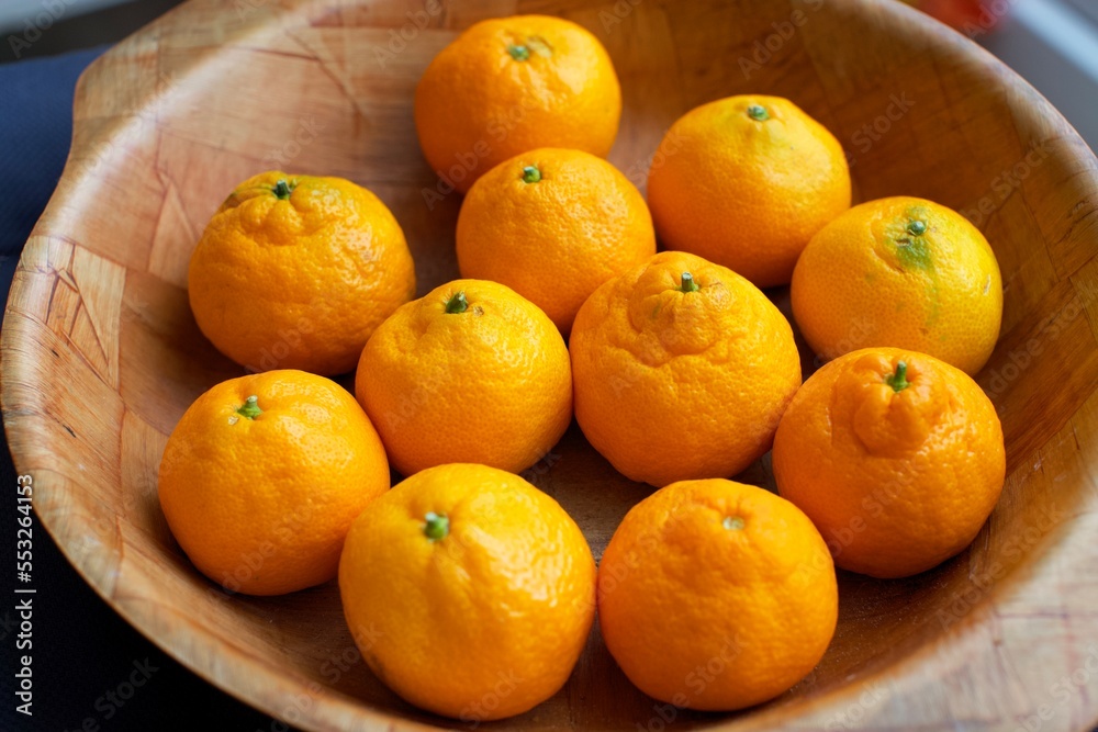 fresh garden tangerines in wooden bowl fresh garden tangerines in wooden bowl