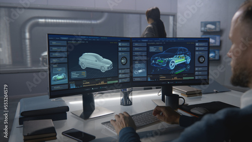 Car design engineers in a lab testing the aerodynamics and body of a new development modern, cutting edge eco-friendly electric car using a wind tunnel with steam.