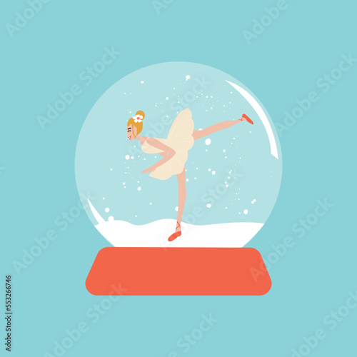 Merry christmas glass ball with a ballerina dancing in the snow. New Year gift.