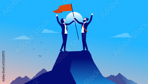 Businesspeople on mountaintop - Two cheerful people on top of mountain raising flag and celebrating success and winning. Flat design vector illustration with blue background