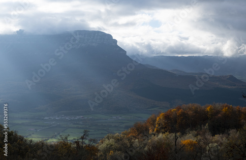Forests with autumn colors in the Aralar mountain range and San Donato mountain in the background, Navarra, Spain. photo